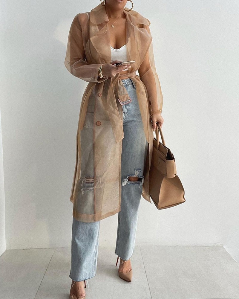 Trench long transparent ceinturé femme élégant et stylé