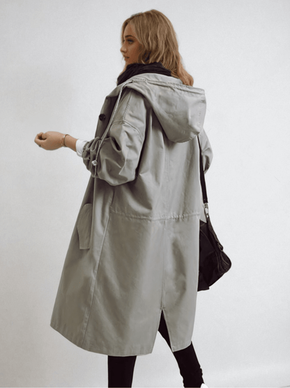 Manteau long chic avec capuche réglable pour un style moderne